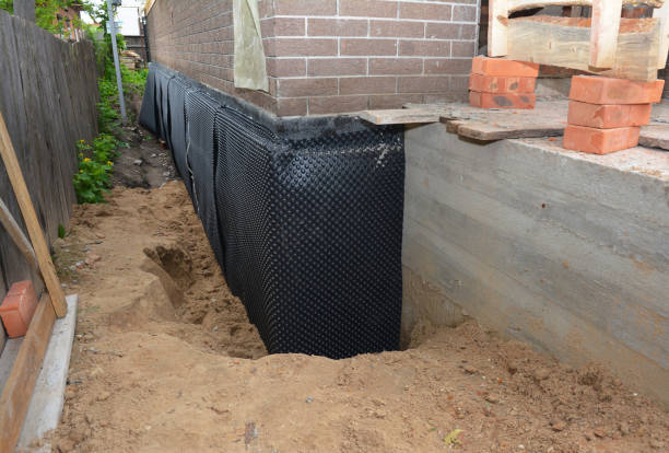 Happy homeowners after waterproofing job in Magnetic Springs